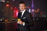 2. David Beckham strikes a pose against the Shanghai skyline