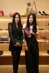 (L-R) Elisa Tan, Juwei Teoh with Ferragamo Zig Zag Aileen Shoulder Bag